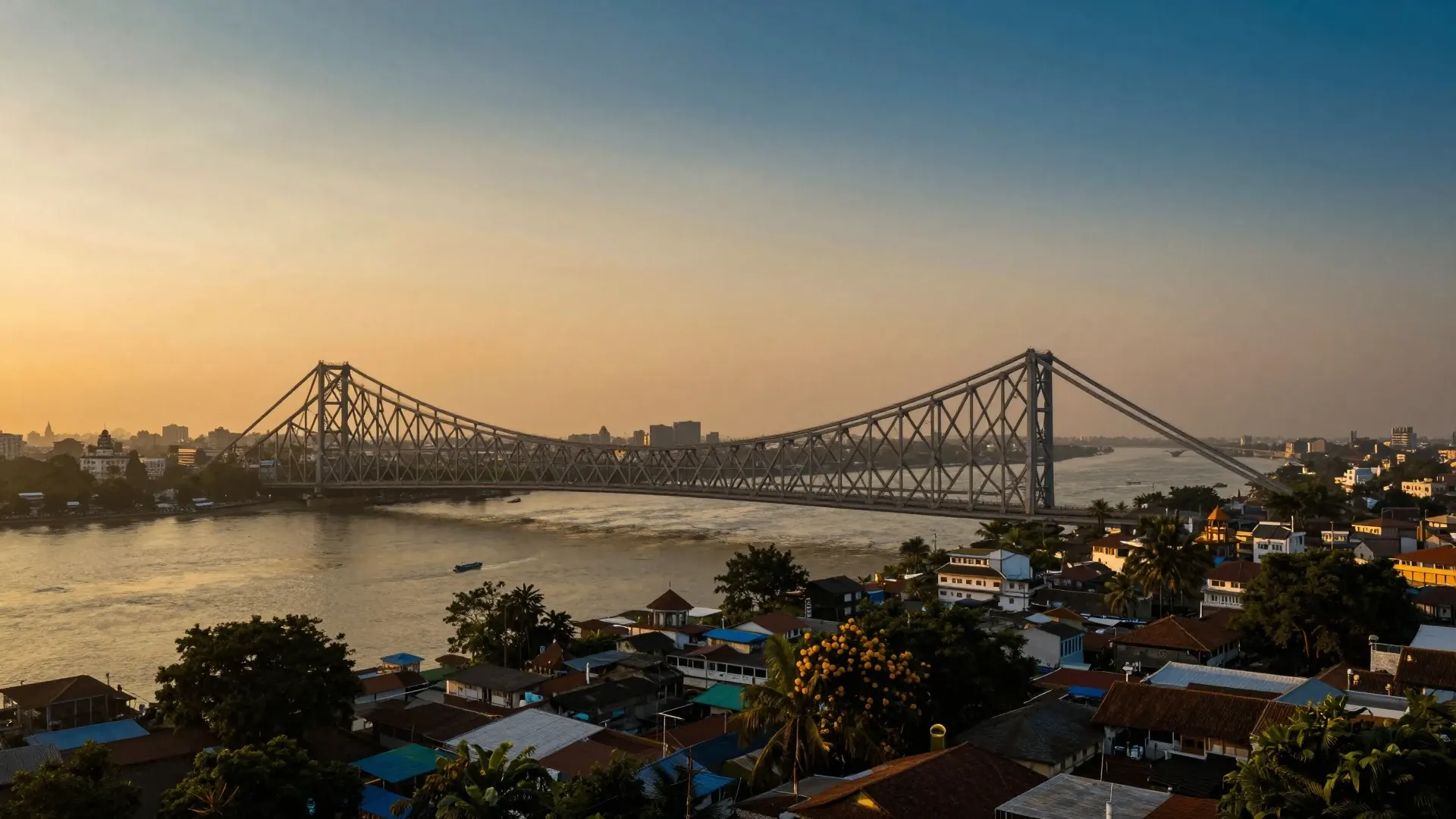 Ponte Howrah sobre o rio Hooghly, em Calcutá, ao pôr do sol